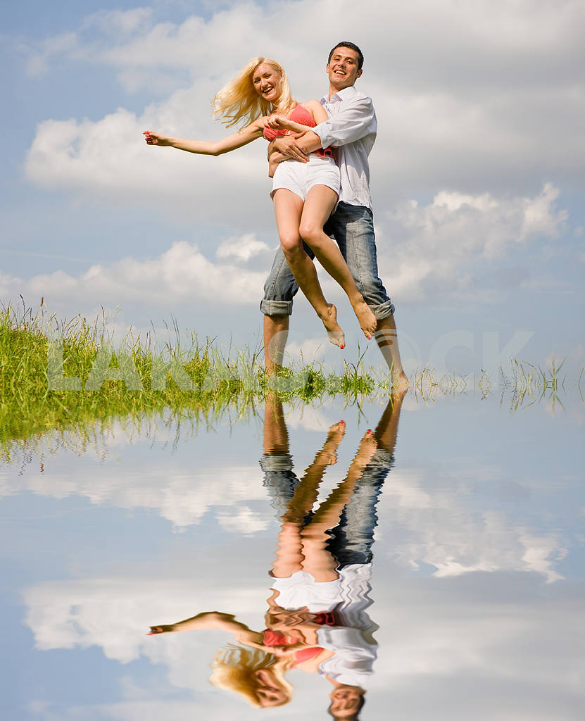 Happy Young love Couple - jumping under blue sky — Image 5190