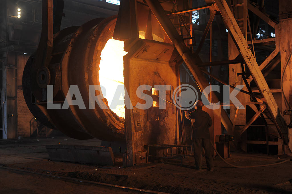 A steel worker takes a sample at steel company — Image 2936