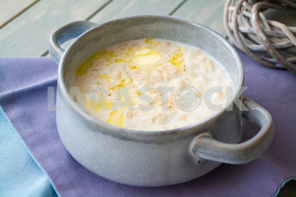 Milk soup with dough on wooden table — Image 83037