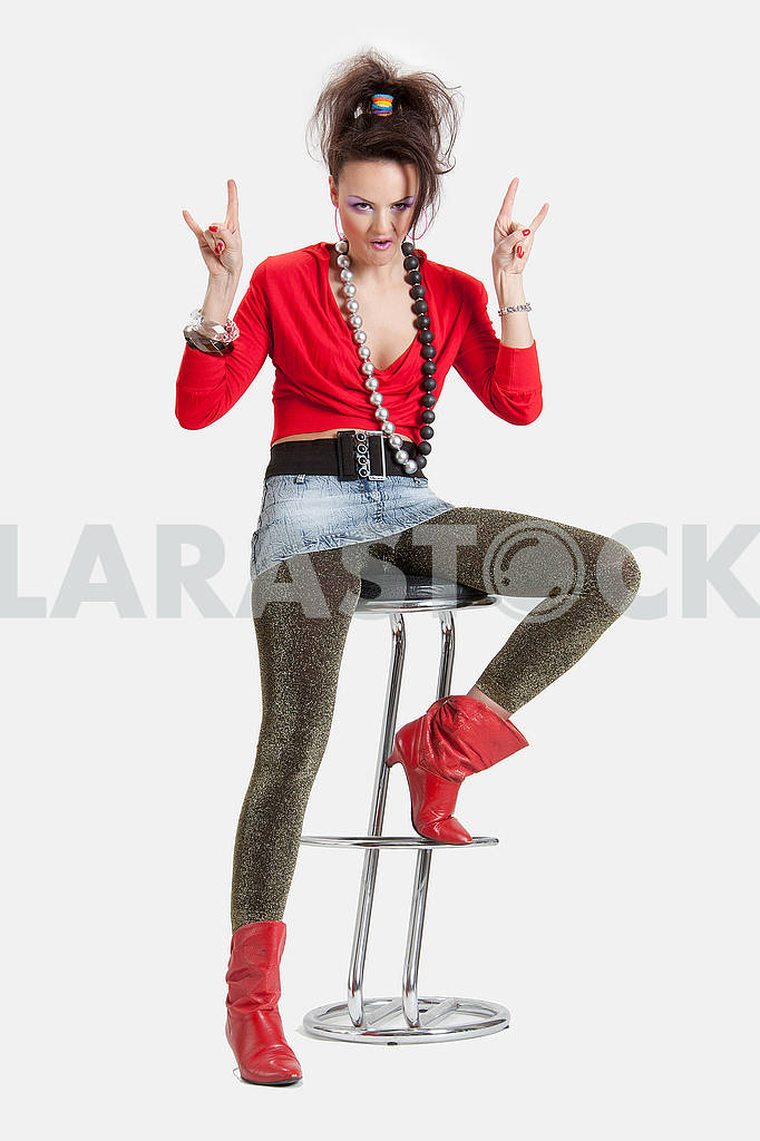 Picture of a young playful lady on a high chair — Image 64448