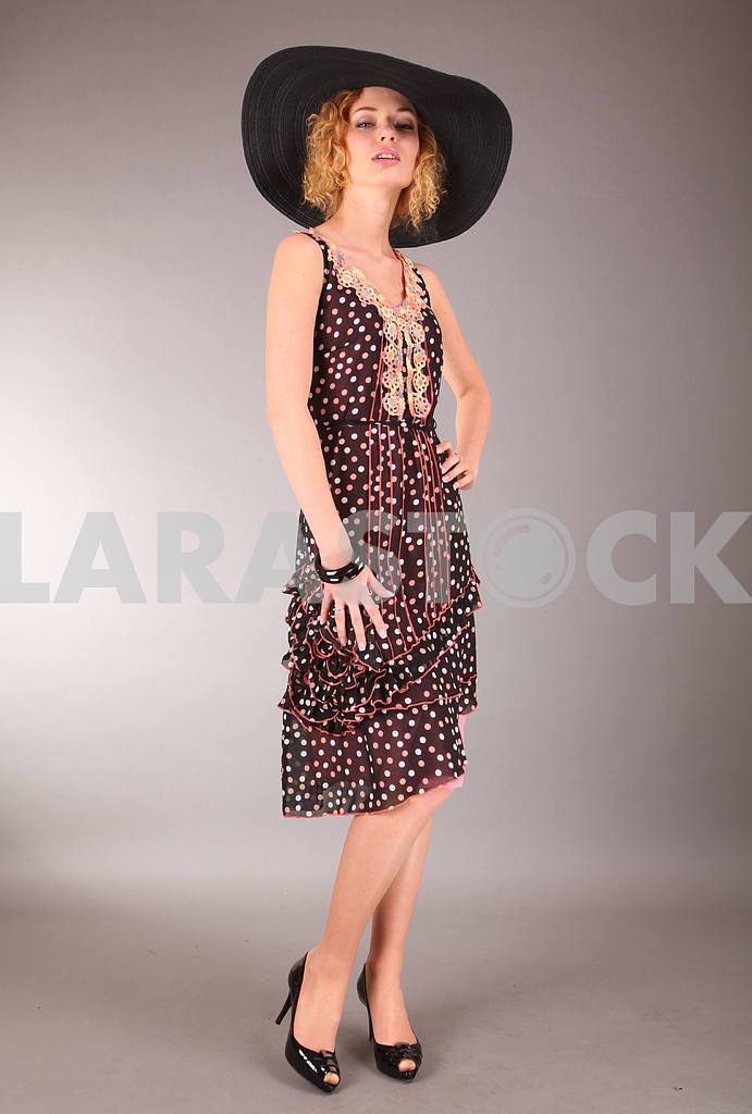 Beautiful young woman in light dress with gray background — Image 7558