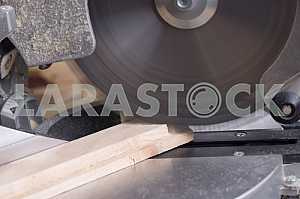 Different construction tools on a wooden background - screwdriver, caliper.