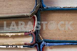 Stack of hardback books on wooden table. Back to school. Copy space