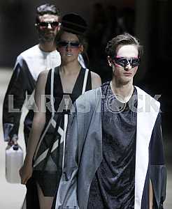 The models in black and white dress demonstrate outfit by Ukrainian designer Kir-Khartley