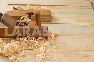 Carpenter tools on wooden table with sawdust. Circular Saw.