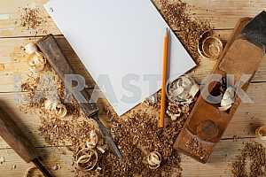 Carpenter tools on wooden table with sawdust. Circular Saw.