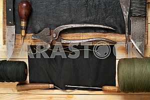 Carpenter tools on wooden table with sawdust. Circular Saw.