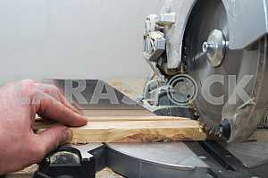 Carpenter tools on wooden table with sawdust. Circular Saw.