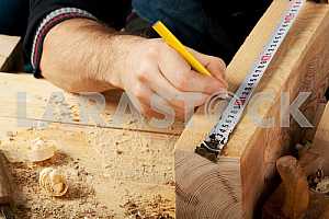 Carpenter tools on wooden table with sawdust. Circular Saw.