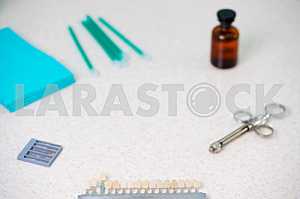 Stomatological instrument in the dentists clinic. Operation, tooth replacement.