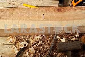Carpenter tools on wooden table with sawdust. Circular Saw.
