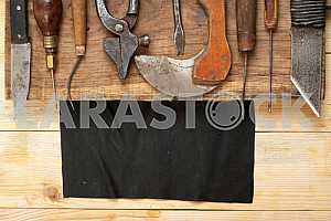 Carpenter tools on wooden table with sawdust. Circular Saw.