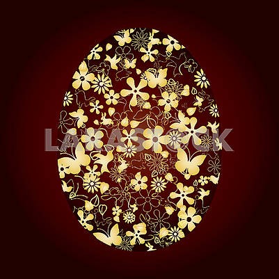 Decorated Easter egg on brown background