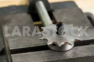 Different construction tools on a wooden background - screwdriver, caliper.