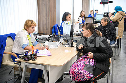 Employees of the Center for Social Services communicates with the visitor