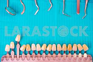 Stomatological instrument in the dentists clinic. Operation, tooth replacement.