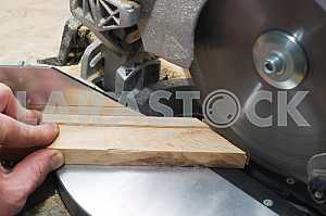 Carpenter tools on wooden table with sawdust. Circular Saw.