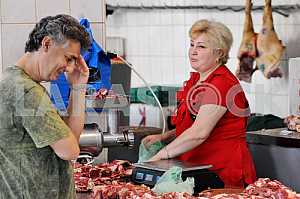 A woman sells meat on the market "Privoz" July 5, 2012