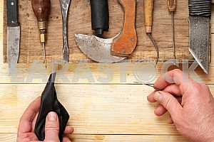 Carpenter tools on wooden table with sawdust. Circular Saw.