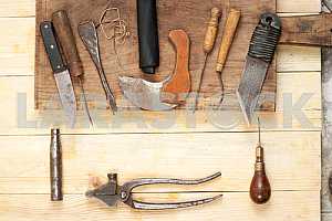 Carpenter tools on wooden table with sawdust. Circular Saw.