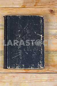 Open book, stack of hardback books on wooden table. Back to school. Copy space