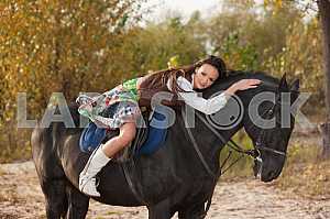 Woman hugging her horse