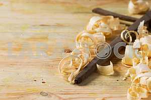 Carpenter tools on wooden table with sawdust. Circular Saw.