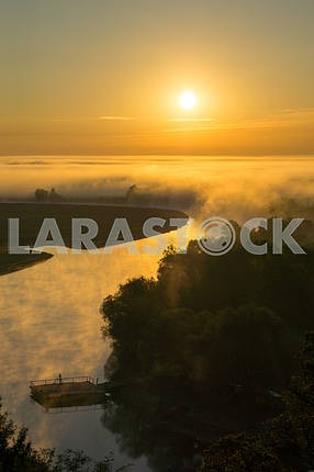The sun and fog over the river Desna. The village of Mezin. Chernihiv region