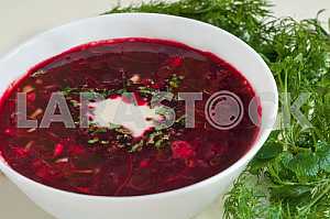 Traditional Ukrainian borsch with sour cream
