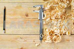 Carpenter tools on wooden table with sawdust. Circular Saw.