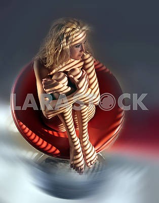 Naked girl sitting in a red armchair