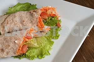 Vegetables with sour cream, wrapped in bread of pita