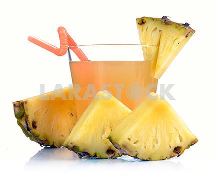 Glass of pineapple juice and pineapple slices