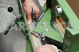 Different construction tools on a wooden background - screwdriver, caliper.