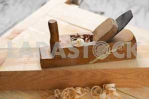 Carpenter tools on wooden table with sawdust. Circular Saw.