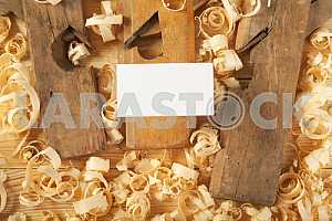 Carpenter tools on wooden table with sawdust. Circular Saw.