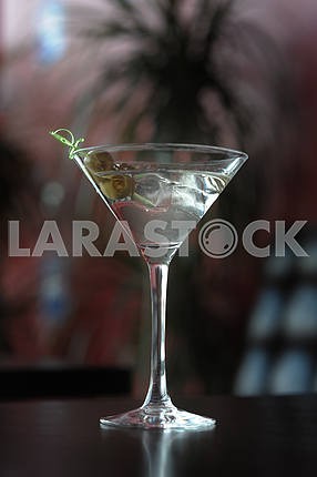 Two olives in a martini glass
