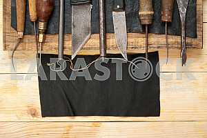 Carpenter tools on wooden table with sawdust. Circular Saw.