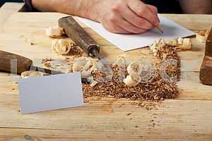 Carpenter tools on wooden table with sawdust. Circular Saw.