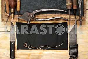 Carpenter tools on wooden table with sawdust. Circular Saw.