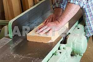 Carpenter tools on wooden table with sawdust. Circular Saw. Carpenter workplace top view