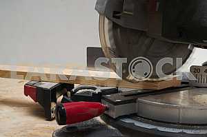 Carpenter tools on wooden table with sawdust. Circular Saw.