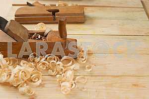 Carpenter tools on wooden table with sawdust. Circular Saw.