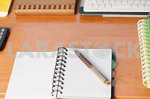 Stack of hardback books on wooden table. Back to school. Copy space. Top view