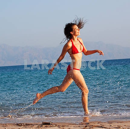 Girl running on beach