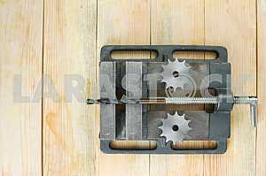 Different construction tools on a wooden background - screwdriver, caliper.
