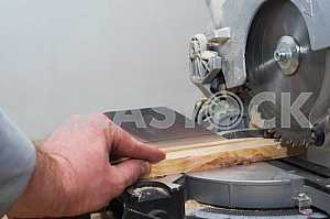 Carpenter tools on wooden table with sawdust. Circular Saw.