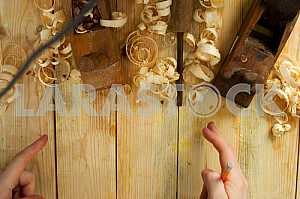 Carpenter tools on wooden table with sawdust. Circular Saw.