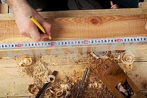 Carpenter tools on wooden table with sawdust. Circular Saw.