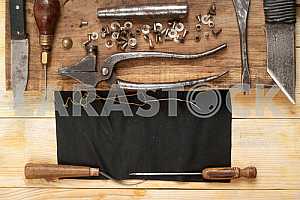 Carpenter tools on wooden table with sawdust. Circular Saw.